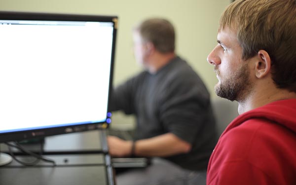 student at computer image